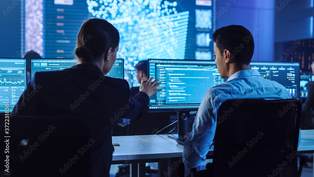 Aufkleber confident female data scientist works closely to her young colleague in big control and monitoring r