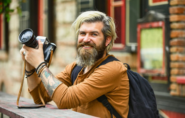 Old technology. Journalist reporter. Professional photographer use vintage camera. Photography business. Bearded man hipster take photo. Brutal stylish man with retro camera. Modern business