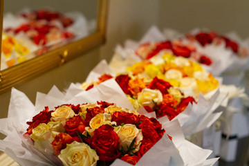 Yellow and red roses in a bouquet 