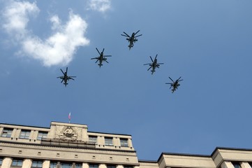 A group of Ka-52 alligator reconnaissance and attack helicopters in the sky over Moscow during the...