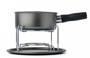 Metal cookware for fondue preparation on white