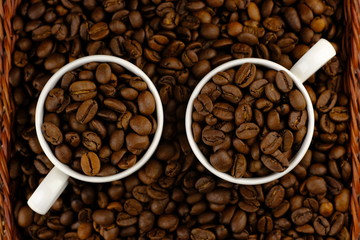 Coffee bean concept macro background. Close up coffee bean like a glasses with cup.