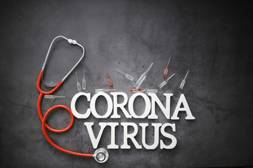 Medical background. Lettering virus. Coronavirus wooden letters. Background of the deadliest pandemic virus in the world. Vaccine for the virus.