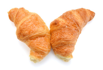 Fresh and tasty croissant over white background