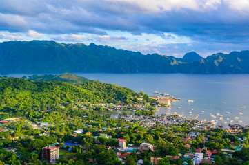 View of Coron Town and Bay from Mount Tapyas on Busuanga Island at sunset - tropical destination with paradise landscape scenery, Palawan, Philippines.