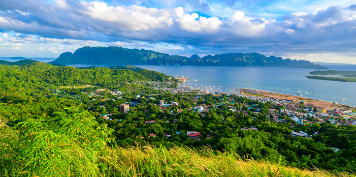 View of Coron Town and Bay from Mount Tapyas on Busuanga Island at sunset - tropical destination with paradise landscape scenery, Palawan, Philippines.