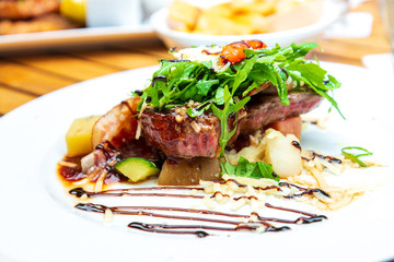 juicy steak beef meat with tomato and potatoes