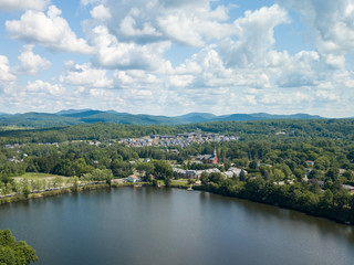Fototapeta na wymiar View of a little town, lake and river from the sky. Cowansville, Quebec, Canada