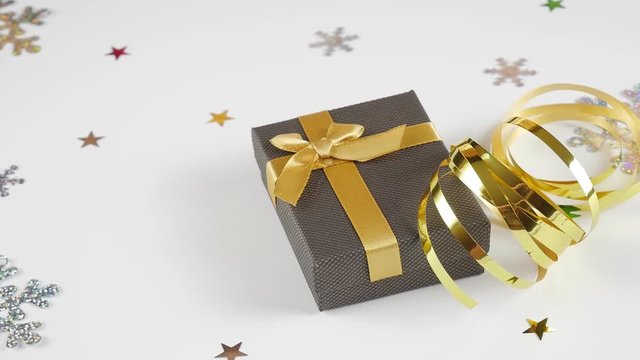 Flatley Christmas. Festive Christmas background. New Year's and Christmas. Christmas card background. Brown Gift and Gold Ribbon. 
