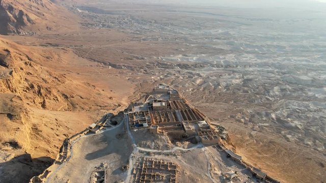 Aerial view of the ruins of Massada is a fortress built by Herod the Great on a cliff-top off the coast of the Dead Sea. Destroyed by the Romans in the 1st century AD e. In UNESCO World Heritage List