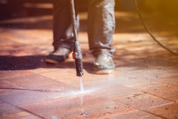 Outdoor floor cleaning with high pressure water jet