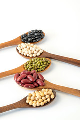 Collection of whole grains seeds isolated on white background. Healthy diet raw ingredients.