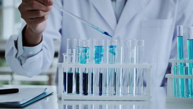 Scientist test for Covid-19 or Corona virus By using science tubes to research and treat illness cancer in lab or hospital. Medical treatment concept