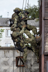 Special forces soldiers storm the walls