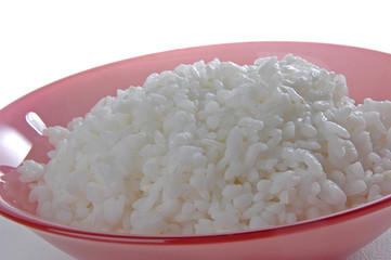 groats in plate on white