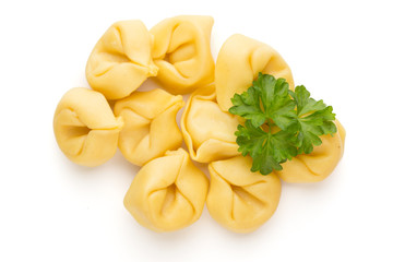 Raw homemade pasta,tortellini with herbs.