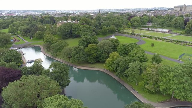 Aerial Drone of Lister Park in Bradford, Yorkshire. Trees, Band Stand and Pond
