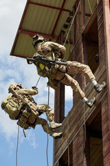 Special forces soldiers storm the walls