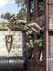 Special forces soldiers storm the walls