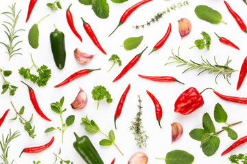 Spice herbal leaves and chili pepper on white background. Vegetables pattern. Floral and vegetables on white background. Top view, flat lay.