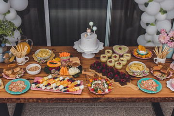 First Anniversary Party. Balloons, food and cake for children's birthday. The first birthday of the baby. Modern Vintage Decor for children's birthday. Birthday party concept.