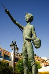 Greece, Symi island, statue at the port, September 28 2008.