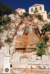 Greece, Symi island, houses built on a rocky cliff's edge, September 28 2008.