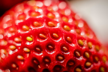 Macro photography of a red strawberry. Strawberry seeds close up