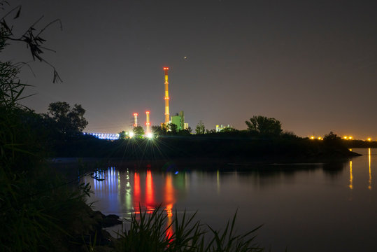 View on the River Vistula in Warsaw, "Elektrociepłownia Żerań" at nihgt, capital city of Poland