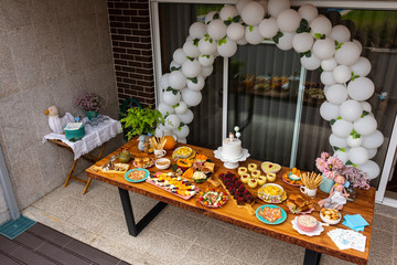First Anniversary Party. Balloons, food and cake for children's birthday. The first birthday of the baby. Modern Vintage Decor for children's birthday. Birthday party concept.