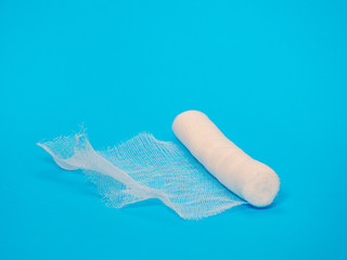 Medical sterile bandage on blue background. Healthcare and medical concept 