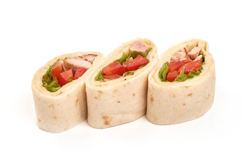 Chicken and vegetables wrapped in a tortilla, isolated on white background