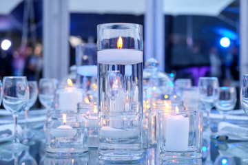 glass candles sticks with blue background lighting.