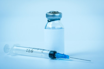 Bottle of medicine and medical syringe for injection