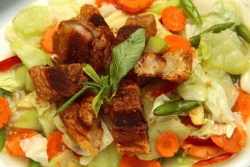 Filipino dish called Chopsuey topped with Lechon Kawali