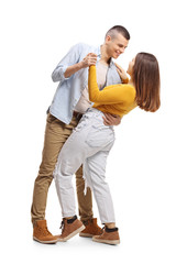 Full length shot of a young guy and girl in casual clothes dancing tango