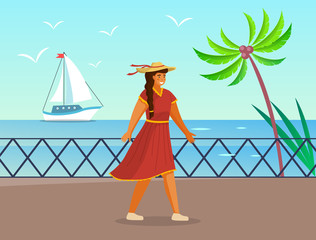 Beautiful girl in a straw hat in summer day outdoor. Young cheerful woman walking on the seashore. Smiling female character wearing red light dress. Elegant pretty girl on vacation near the sea