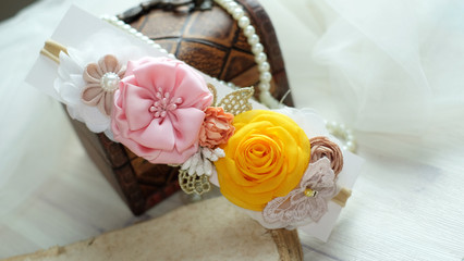 A bouquet of flowers made out of fabric cloth textile in beautiful pastel colors that can be used as hair accessory, decoration, and embellishment