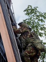 Special forces soldiers storm the walls