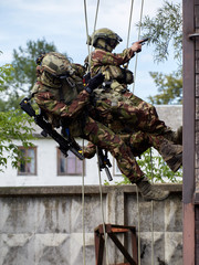 Special forces soldiers storm the walls