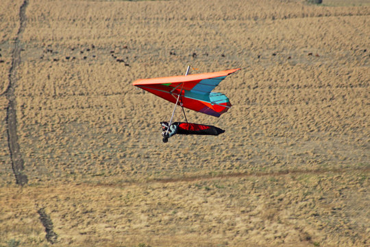 CRIMEA, UKRAINE - SEPTEMBER 4: Competitor Petro Usenko of the Grininko hang gliding competitions takes part in the Klementieva mountain on September 4, 2012 in Crimea, Ukraine