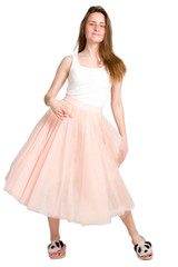 a young woman, smiling and dancing, a girl in a pink skirt and a white t-shirt.