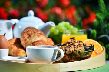 Breakfast served with coffee, juice, croissants and fruits