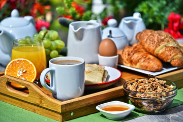 Breakfast served with coffee, juice, croissants and fruits