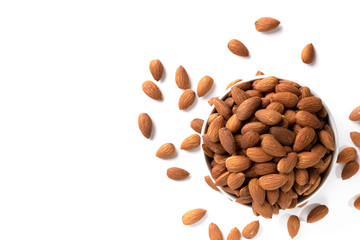 Top view, almonds in white bowl on white background with space for your text.
