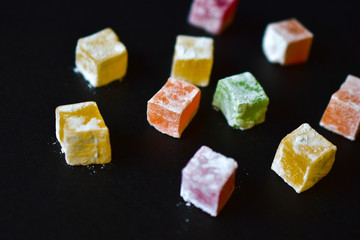 Delicious Oriental sweets Turkish delight on a black background