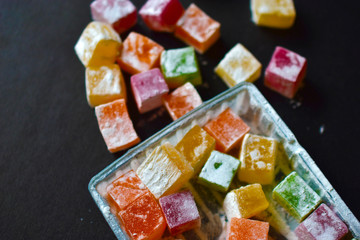 Delicious Oriental sweets Turkish delight on a black background