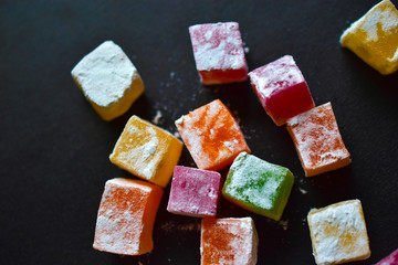 Delicious Oriental sweets Turkish delight on a black background