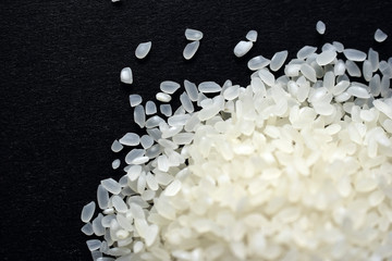 Pile of white rice for pilaf on a black background