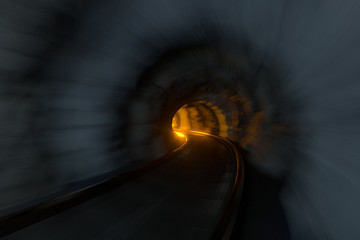 The rail tunnel with light illuminated in the end, 3d rendering.